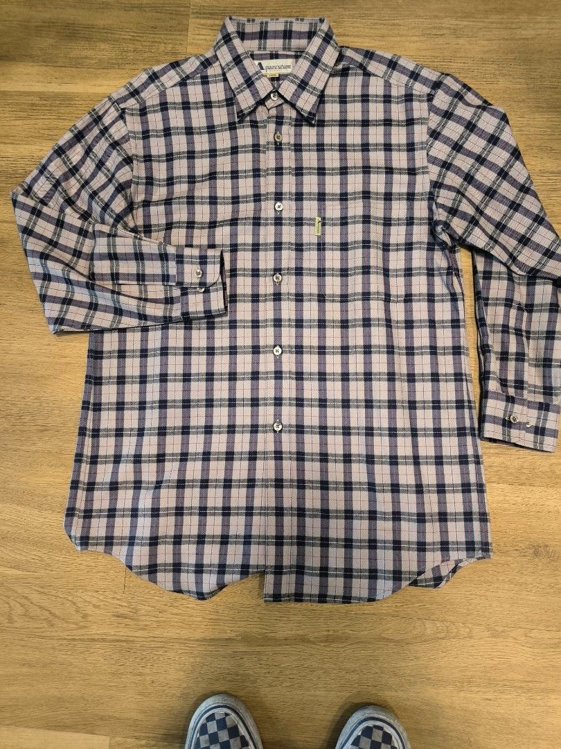 Aquascutum Plaid Button-Down Shirt Size L (Category: Tshirts & Polo Shirts ) located in Caloocan City. Submitted by wan_l_as (Listing ID 1470392544, Image 1). Description: - Brand: Aquascutum - Style: Long sleeve button-down shirt - Pattern: Classic check (cream, navy, and red tones) - Size: Large - Details: Chest pocket with yellow brand tag, button cuffs - Condition: Clean, sharp collar and hems.