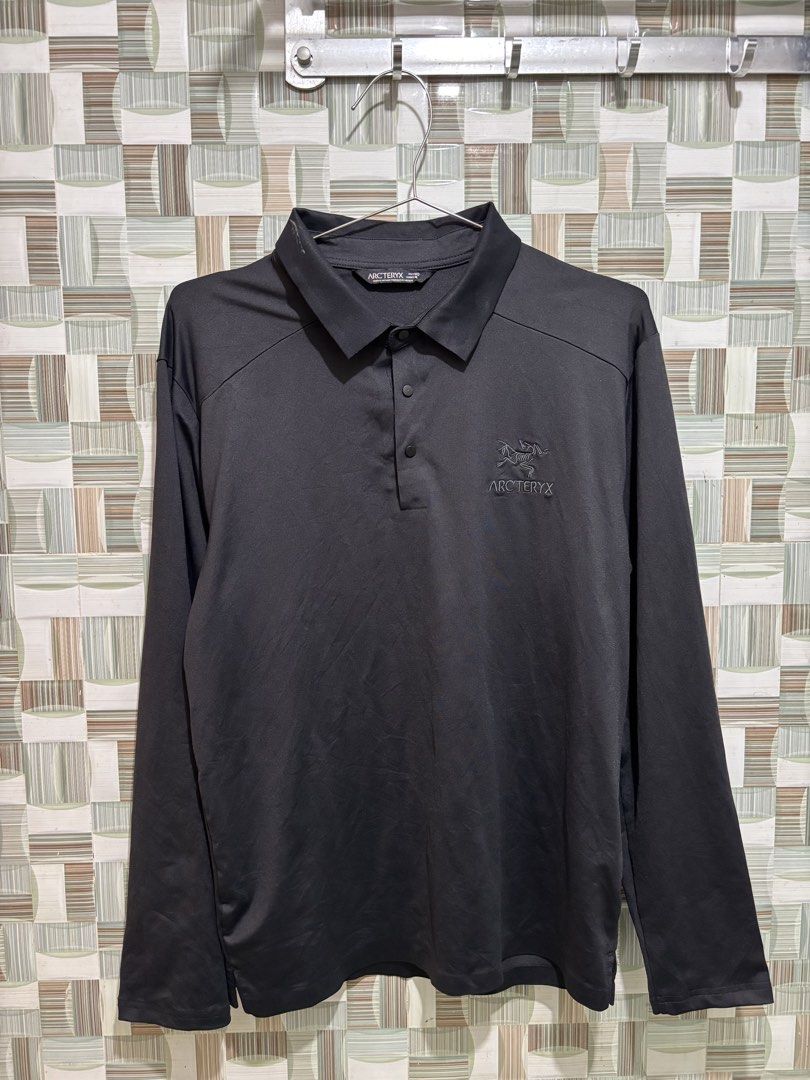 Arc'teryx Long Sleeve Polo Shirt (Category: Tshirts & Polo Shirts ) located in Caloocan City. Submitted by nlubon (Listing ID 1470459450, Image 2). Description: - Brand: Arc'teryx - Item: Long Sleeve Polo Shirt - Color: Black - Size: Men's Medium (Regular Fit) - Material: Lightweight technical fabric - Details: 3-button collar, embroidered logo on left chest - Origin: Made in Vietnam - Condition: Clean inside and out, tags intact.