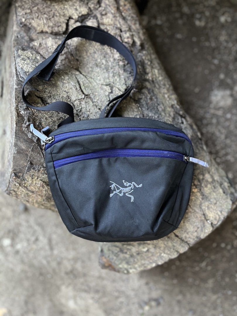 Arc'teryx Mantis 2 Waist Pack Black Purple (Category: Belt bags, Clutches and Pouches) located in Calabanga. Submitted by jijithriftcamarinessur (Listing ID 1470400939, Image 1). Description: - Brand: Arc'teryx Mantis 2 Waist Pack - Colorway: Sleek black with stylish purple zippers and back panel - Condition: Brand new, tags still attached inside (Pristine, clean inside and out) - Interior: White lining equipped with multiple organizational pocke