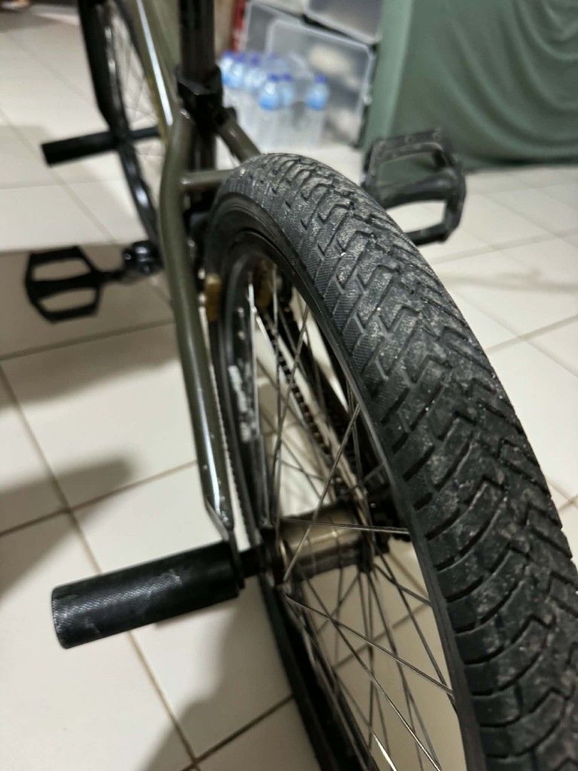 Aresbikes BMX bicycle dark green with extra handlebar (Category: Bicycles) located in Manila. Submitted by waffle008 (Listing ID 1470552883, Image 3). Description: - Brand: Aresbikes BMX bike in sleek dark green - Frame: Features authentic Aresbikes logo lettering - Setup: Equipped with stunt pegs on both wheels - Brakes: Reliable front and rear handbrakes - Extras: Includes an extra chrome handlebar - Components: Standard black pedals, comfortab