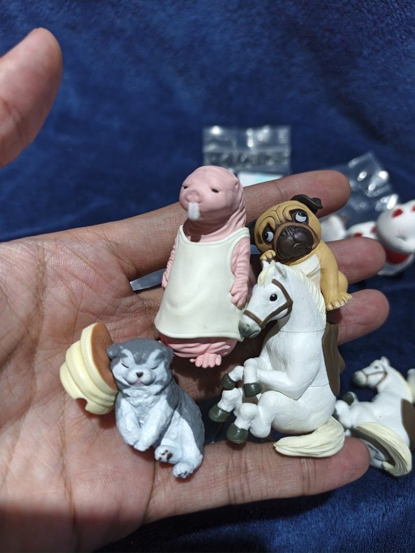 Assorted Cute Animal and Character Gachapon Figures (Category: Designer & Blind Box Toys) located in Manila. Submitted by kirstentoyshub (Listing ID 1470473694, Image 2). Description: - Collection of random miniature figures (foxes, horses, pug, apron-wearing naked mole rat, sleeping dog with pancakes, gorilla, yellow cartoon character) - Condition: Mix of brand new (sealed in original plastic) and loose figures - Ideal for miniature collectors, 