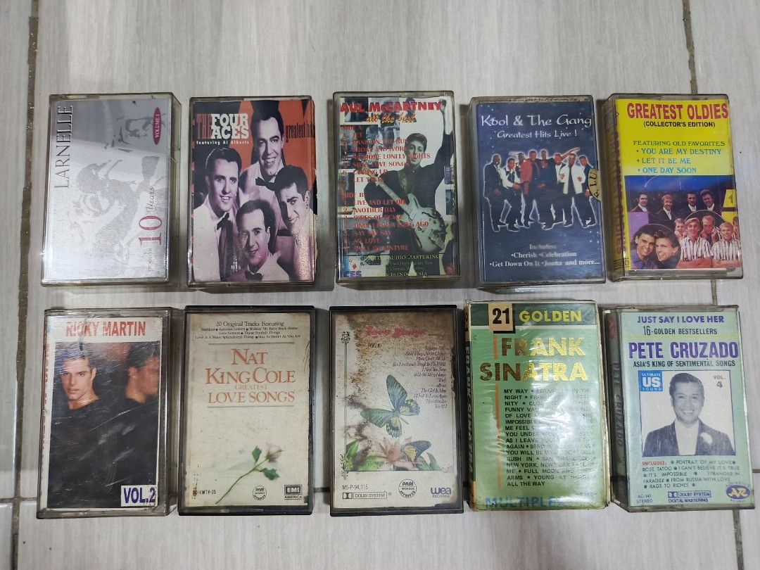 Assorted Vintage Music Cassette Tapes Bundle (Category: CDs & DVDs) located in Manila. Submitted by milkenshie87625 (Listing ID 1470544845, Image 1). Description: - Set of 10 classic cassette tapes with plastic cases - Features legendary artists: Frank Sinatra, Ricky Martin, Nat King Cole, Paul McCartney, The Four Aces, and Kool & The Gang - Includes various compilation albums and greatest hits collections - Tested and great for vintage cassette 