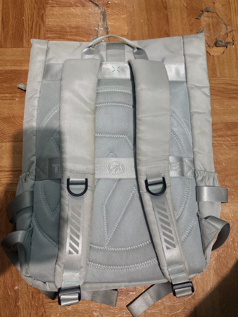 ASUS laptop backpack with multiple pockets (Category: Backpacks) located in Trece Martires City. Submitted by garciaclaudinejoy (Listing ID 1470376307, Image 2). Description: - Color: Light grey ISSUE: MADUMI, need labhan - Closure: Secure front buckle - Storage: Multiple zippered compartments and side water bottle pockets - Comfort: Padded shoulder straps with adjustable buckles and D-rings - Design: Geometric quilted stitching on the back panel