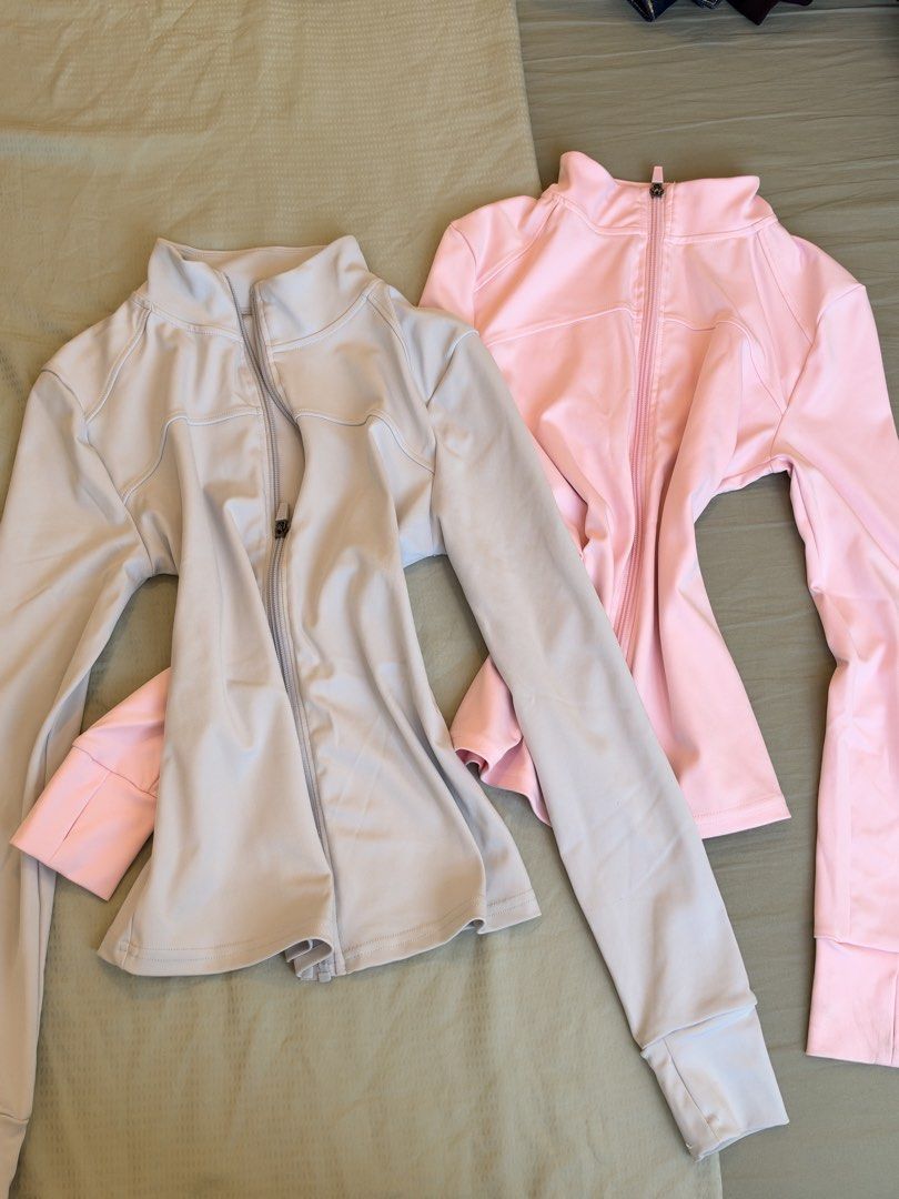 Athletic Zip Jacket with Thumbholes Pink and Grey Bundle (Category: Coats, Jackets and Outerwear) located in Makati City. Submitted by itsmeann09 (Listing ID 1470393513, Image 1). Description: - Set of 2: Pastel Pink & Soft Grey - Features: Long sleeves with thumbhole cuffs & high collars - Fabric: Smooth, ultra-stretchy, and breathable - Ideal for: Gym workouts, running, or casual everyday wear - Condition: Brand new / Excellent quality.