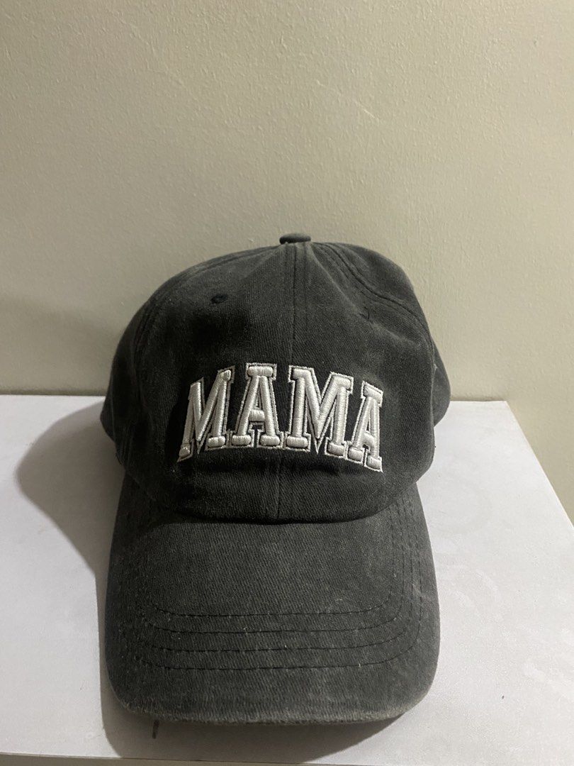 AUSTRALIA EXLCUSIVE Dark Grey MAMA Embroidered Baseball Cap Hat (Category: Hats & Beanies) located in Manila. Submitted by primomirp (Listing ID 1470455753, Image 1). Description: Dark grey baseball cap with white embroidered text reading MAMA across the front. Classic curved brim and structured front panels. Adjustable strap with a metal buckle closure in the back for a customizable fit. Unlined interior with taped seams for comfort. Washed fabr