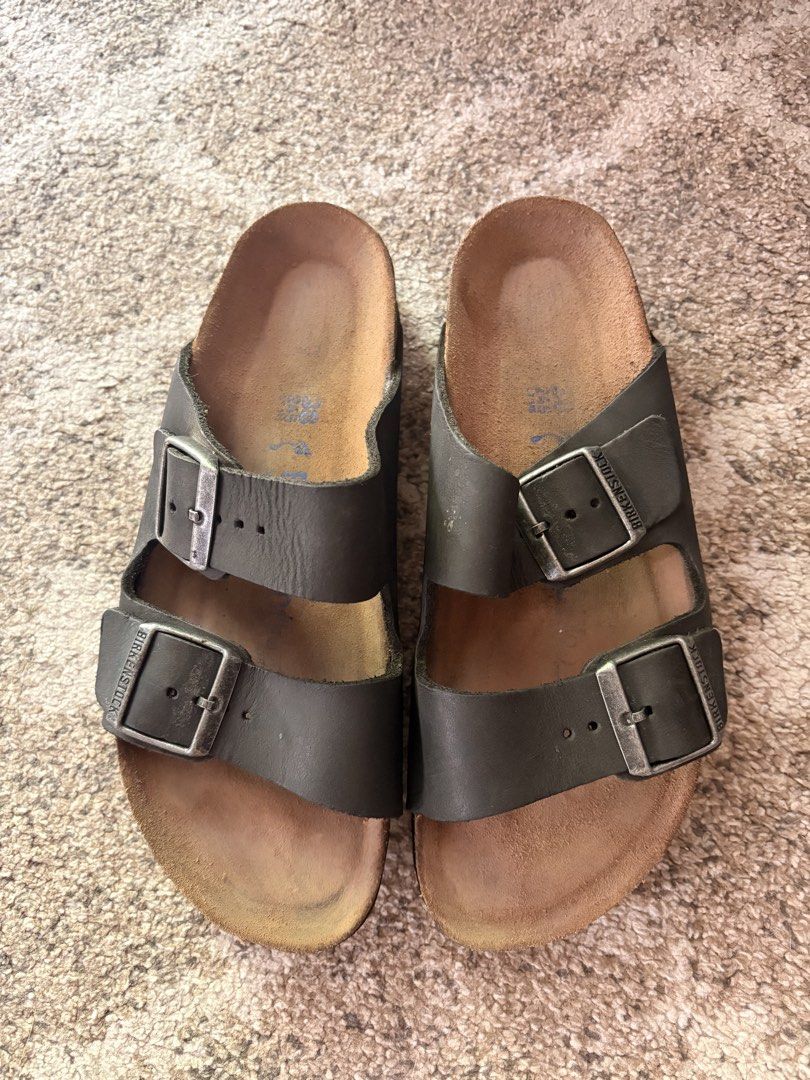 Auth Preloved Birkenstock Arizona (Category: Slippers and slides) located in Paranaque City. Submitted by silentstone.dolphin (Listing ID 1470356690, Image 1). Description: Oiled Leather Material.. Color Black/Charcoal Brass Buckle.. Soft Footbed.. Visible Print.. Size 38N.. Super Nice in Actual😍 .