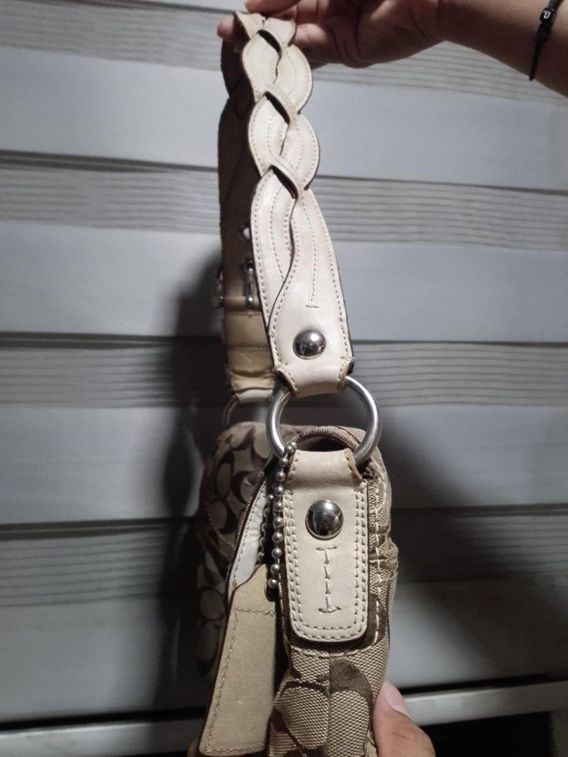 Authentic Coach Soho Double Flap Canvas Shoulder Bag (Category: Luxury Bags & Wallets) located in Alaminos. Submitted by maribelsyyyy_ (Listing ID 1470473504, Image 2). Description: - Authentic Coach signature C jacquard shoulder bag (Khaki/Brown with White leather trim) - Classic early 2000s Y2K aesthetic with front buckle flap closure - Stylish and comfortable braided leather shoulder strap with silver-tone hardware - Interior lined with smooth