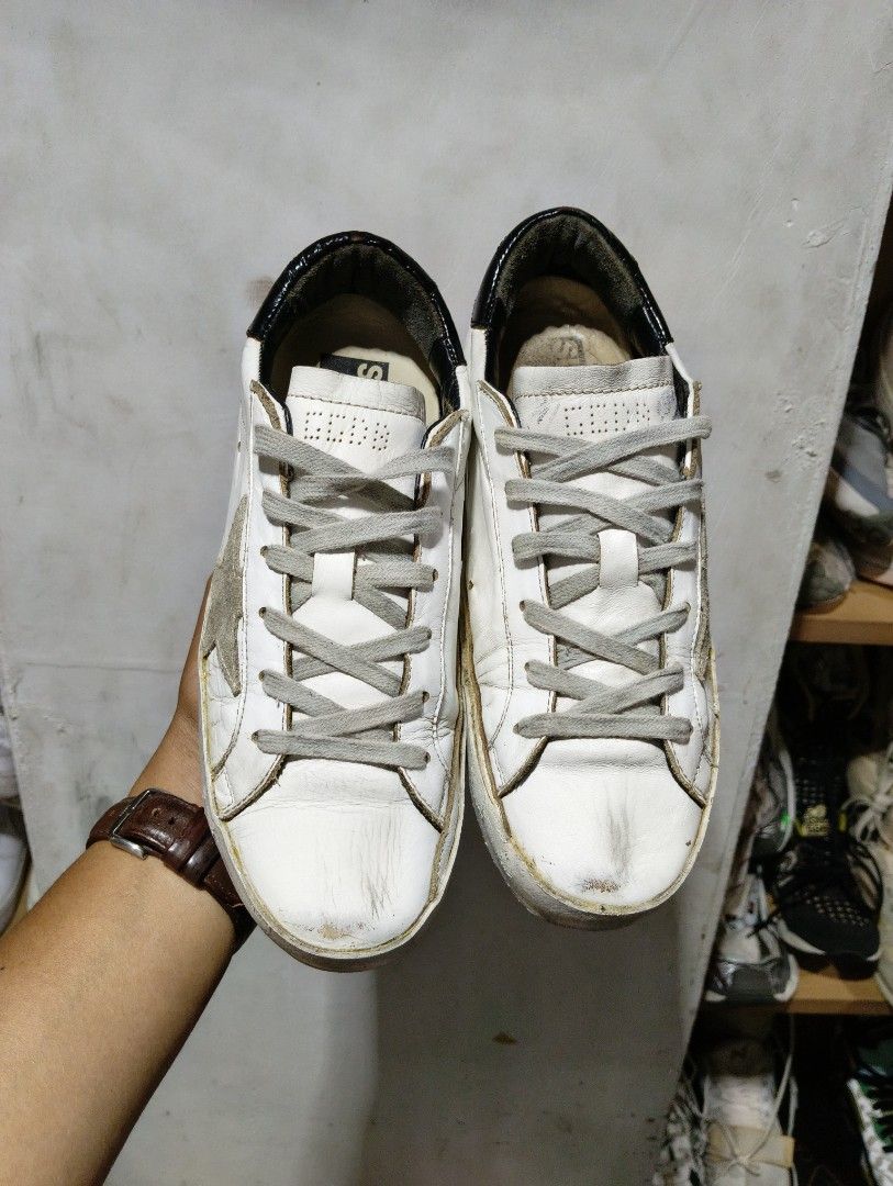 Authentic Golden goose size 38 (Category: Sneakers & Footwear) located in Cagayan de Oro. Submitted by warmbird-f84aab (Listing ID 1470552720, Image 2). Description: Classic GGDB Superstar in iconic white/ice suede star + black heel tab 🖤 ✅ Authentic pre-loved condition, natural vintage distressing (part of the design!) ✅ Size EU 38 | Genuine leather | Made in Italy 🇮🇹 ✅ no major damage—just normal wear ✅ Super comfy & timeless, goes with ever
