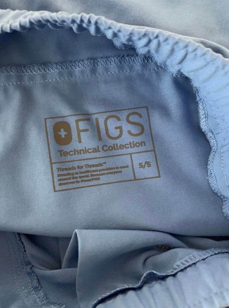 Authentic Like-New FIGS Scrub Set (Category: Activewear) located in San Juan. Submitted by docpratty (Listing ID 1470512167, Image 3). Description: Authentic like-new FIGS scrub set in Capri Blue. Casma Three-Pocket Scrub Top, size XS, and Jogger Scrub Pants, size S Short..