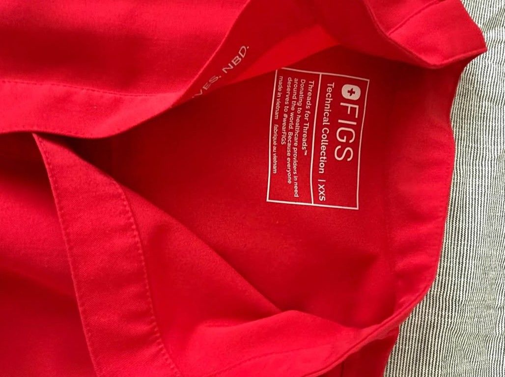 Authentic Like-New FIGS Scrub Set (Category: Activewear) located in San Juan. Submitted by docpratty (Listing ID 1470516098, Image 3). Description: FIGS Fiery Red Scrub Set Rafaela Oversized Scrub Top – XXS Zamora Jogger Scrub Pants – Small/Petite.