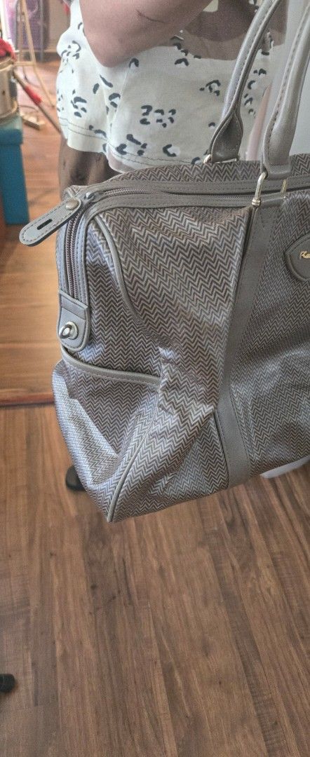 Authentic Pierre Cardin Large Boston Bag (Category: Luxury Bags & Wallets) located in Quezon City. Submitted by PreLovedByMrsAL (Listing ID 1470373270, Image 2). Description: - Authentic Pierre Cardin handbag in brown - Stylish zigzag chevron pattern with solid brown trim - Structured shape with front logo plaque - Roomy interior, ideal for daily essentials or travel - Condition: Excellent / Preloved (ready to use) bought from Japan photos as pos
