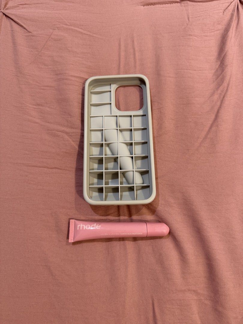 authentic rhode lip phone case iphone 15 pro max (free peptide lip) (Category: Cases & Sleeves) located in Manila. Submitted by _____car0usell (Listing ID 1470497939, Image 3). Description: - Authentic Rhode Lip Case in Gray + Rhode Peptide Lip Tint in Ribbon (free) - for iPhone 15 pro max - bought brand new and shipped from the US. I believe its around 4.5k php for both the case and lip tint - lip case is in like-new condition - minor flaw on th