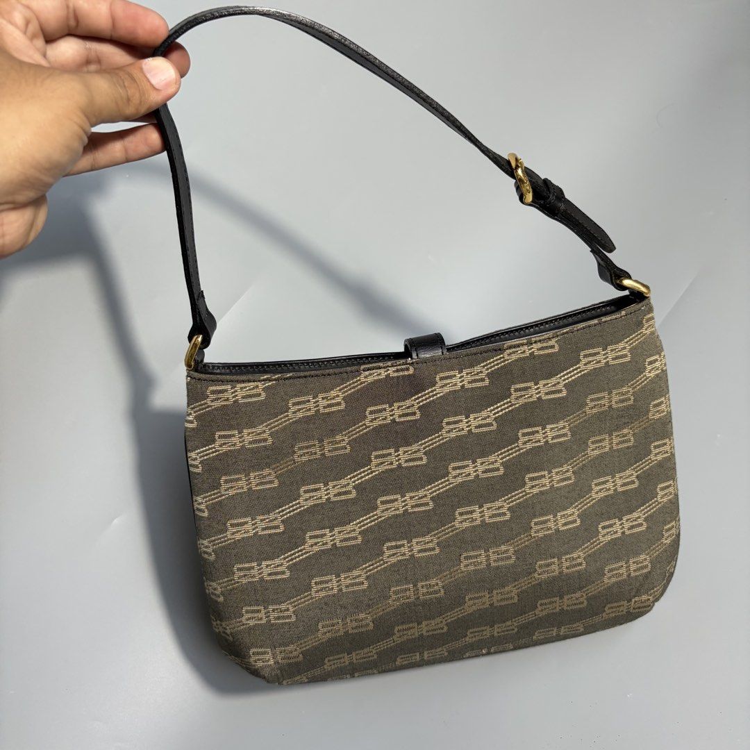 Authentic vintage Balenciaga shoulder bag , black, all-over logo pattern (Category: Luxury Bags & Wallets) located in Magalang. Submitted by luxgood18 (Listing ID 1470453036, Image 2). Description: vintage Balenciaga BB Monogram Canvas Shoulder Bag dating back to the late 1990s or early 2000s (Y2K era) Rank A Guaranteed authentic.