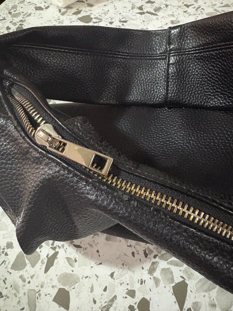 Aztrid Black Leather Hobo Shoulder Bag (Category: Shoulder Bags) located in Mandaluyong City. Submitted by theameii (Listing ID 1470415285, Image 1). Description: - Brand: Aztrid - Color/Finish: Black pebble-textured leather - Style: Large slouchy hobo shoulder bag with a wide strap - Closure: Top zip with silver-tone metal pull - Capacity: Spacious interior, perfect for daily essentials - Condition: Excellent.
