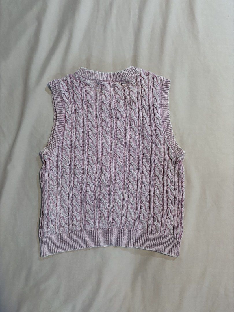 Baby Pink Cable-Knit Vest Top (Category: Sleeveless) located in Quezon City. Submitted by cmtom (Listing ID 1470368942, Image 2). Description: Loc: qc pink crop vest top from bershka, bought in 2022. Was my fav top for a while, super flattering faded pink color and can be worn alone Best fits size XS-S the fabric has become slightly stiff after multiple washes (but still fits nicely), bottom part is a little wavy.