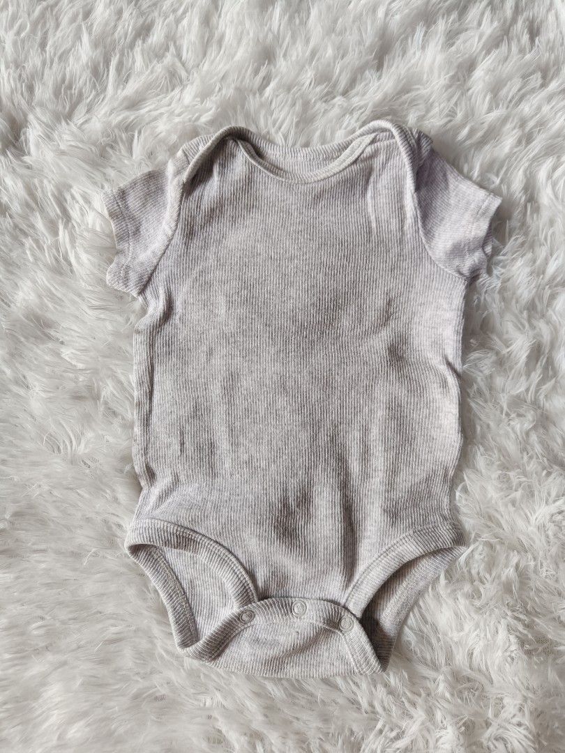 Baby Short sleeve Onesies (Category: Babies & Kids Fashion) located in Orani. Submitted by mbfb_btn (Listing ID 1470432062, Image 2). Description: - Bundle of short-sleeve baby onesies in standard infant sizing 0-3 months - 50 each (can give 3 for 100 if you buy in bundles) - Includes assorted designs: striped, plain ribbed grey, teddy bear print, elephant & turtle print, and a white one with a blue/orange monster patch - Made from soft, breathab
