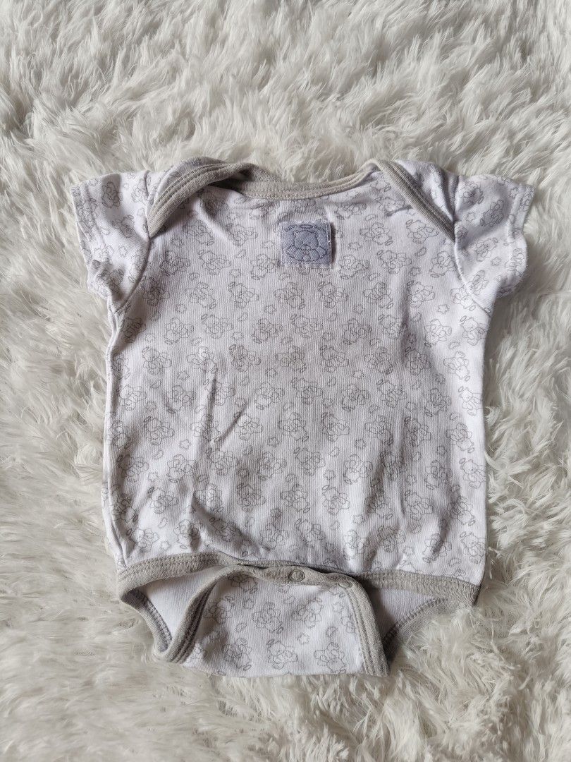 Baby Short sleeve Onesies (Category: Babies & Kids Fashion) located in Orani. Submitted by mbfb_btn (Listing ID 1470432062, Image 3). Description: - Bundle of short-sleeve baby onesies in standard infant sizing 0-3 months - 50 each (can give 3 for 100 if you buy in bundles) - Includes assorted designs: striped, plain ribbed grey, teddy bear print, elephant & turtle print, and a white one with a blue/orange monster patch - Made from soft, breathab