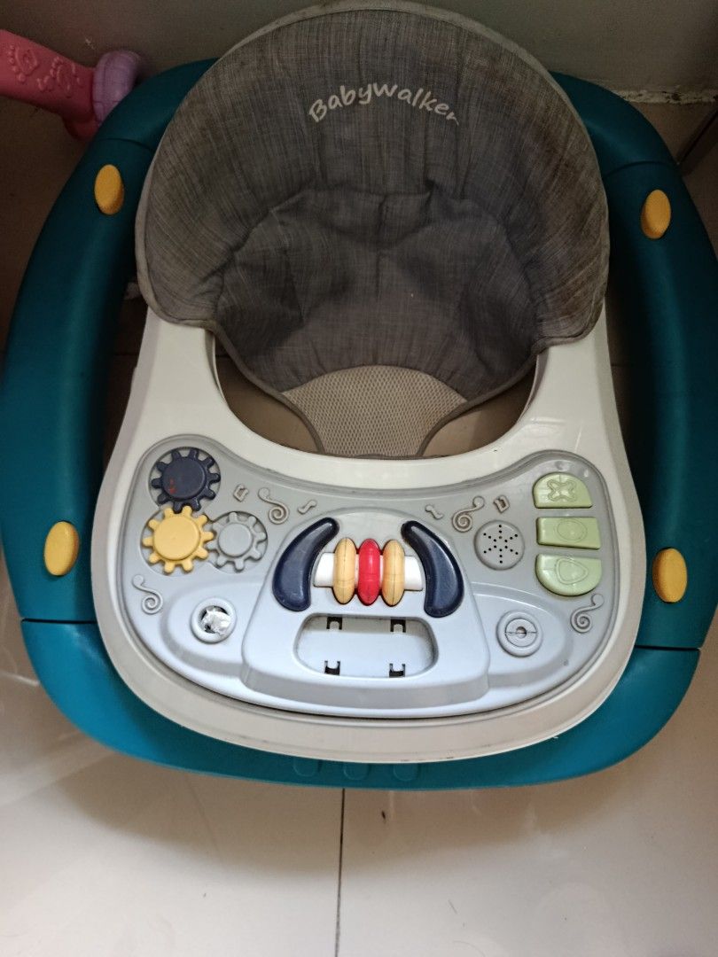 Baby walker with interactive activity tray and gray seat (Category: Infant Playtime) located in Mandaluyong City. Submitted by 3la1n333.1 (Listing ID 1470387750, Image 1). Description: 🍼 PRE-LOVED BABY WALKER FOR SALE! 🍼 ✨ Well-loved but still usable! ✨ Perfect for parents looking for a budget-friendly baby walker! 💕 ✅ Adjustable height ✅ Well-used condition ✅ Super affordable! ⚠️ Issues (Honest Disclosure): - Broken mechanism on the top toy -