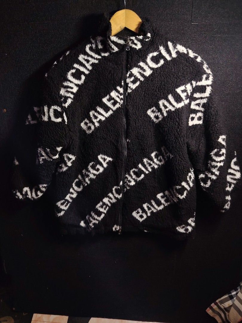 Balenciaga All Over Logo Fleece Jacket (Category: Coats, Jackets and Outerwear) located in Baguio. Submitted by tabuzomaria1422 (Listing ID 1470486473, Image 1). Description: - Authentic Balenciaga fleece jacket - Color: Black with all-over white logo print - Material: Heavy fuzzy texture with quilted black lining - Features: Stand-up collar, full zip closure, and inner tag with style code - Fit: Relaxed fit, exceptionally warm for winter - Origi