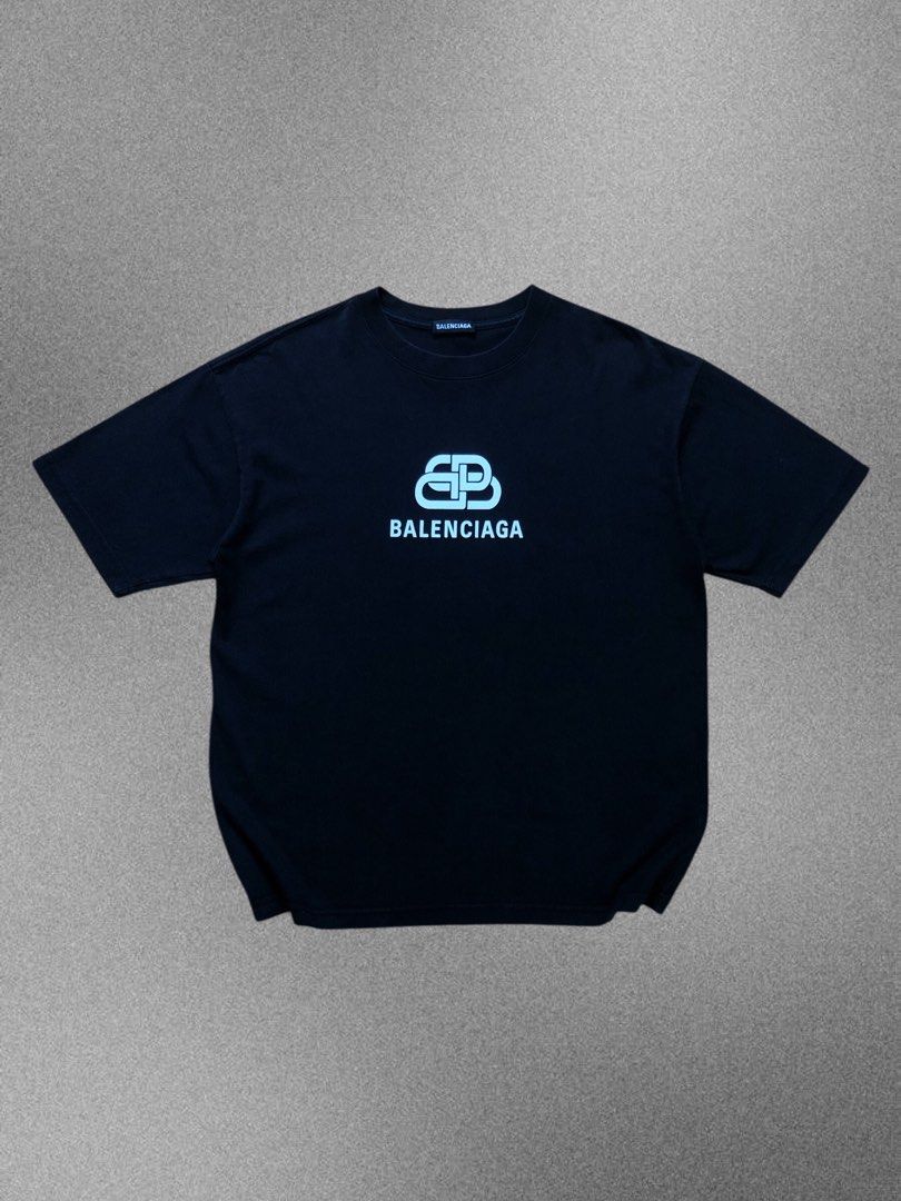Balenciaga BB Logo Oversized Tee Black (Category: Shirts) located in Manila. Submitted by purewater.2554df (Listing ID 1470499003, Image 1). Description: - Authentic Balenciaga black t-shirt - Size: Extra Small (XS) - Material: Premium heavy cotton - Design: White BB logo graphic on the chest - Details: Crew neck, short sleeves, interior woven brand labels intact - Origin: Made in Portugal - Condition: Excellent.