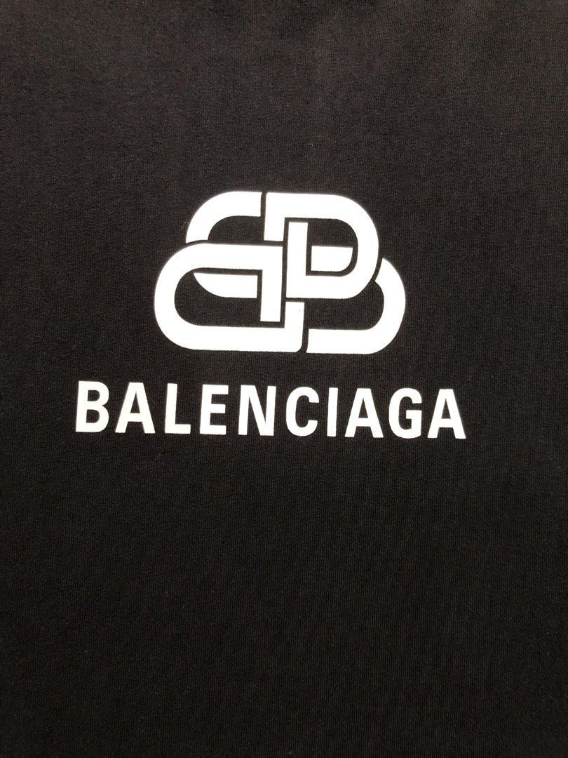 Balenciaga BB Logo Oversized Tee Black (Category: Shirts) located in Manila. Submitted by purewater.2554df (Listing ID 1470499003, Image 2). Description: - Authentic Balenciaga black t-shirt - Size: Extra Small (XS) - Material: Premium heavy cotton - Design: White BB logo graphic on the chest - Details: Crew neck, short sleeves, interior woven brand labels intact - Origin: Made in Portugal - Condition: Excellent.
