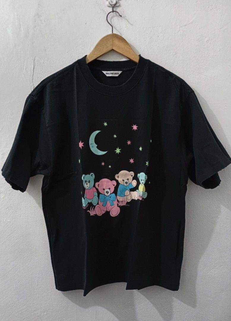 Balenciaga Bears Graphic OverSized TShirts (Category: Luxury Apparel) located in Manila. Submitted by eriiicaspage (Listing ID 1470508004, Image 3). Description: PreOwned likeNew lightly Used Balenciaga Teddy bears Graphic OverSized TeeShirt Crewneckline XS on Sizetag fits up to Large frame. W22-23" X L27" - Color: Black with cute teddy bear and moon graphic - Back Detail: Printed quote 'love is so much fun it can be so good like a morning run in