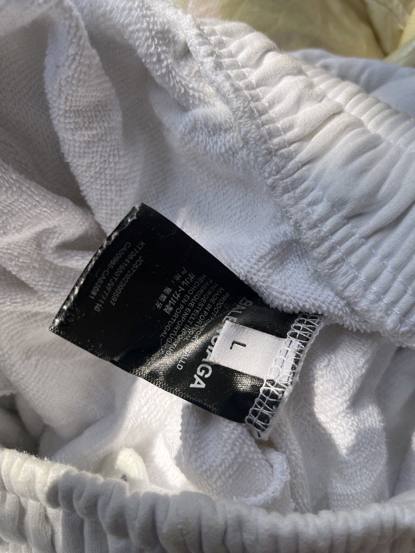 Balenciaga Multi Logo Printed Sweatpants White Size L (Category: Joggers) located in Manila. Submitted by shanaaa.collects (Listing ID 1470394929, Image 3). Description: - Brand: Balenciaga - Color: White - Material: Heavy cotton fleece - Design: All-over brand logo prints on legs - Details: Elastic waistband with adjustable drawstring - Origin: Made in Portugal - Size: L (tag attached) - Condition: Shows some light stains from wear - Style: Perf