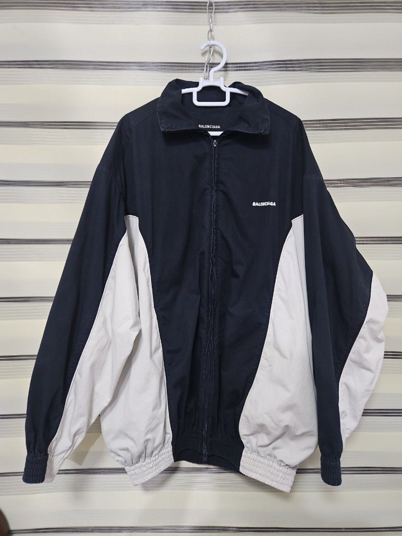 Balenciaga Navy and White Zip Jacket Size 46 (Category: Luxury Apparel) located in Santa Maria. Submitted by rommelmateo (Listing ID 1470531688, Image 1). Description: - Authentic Balenciaga zip-up jacket - Stylish navy and white color-block design with contrast side panels - Relaxed fit featuring elasticated cuffs and hem - High collar with full front zipper closure - Subtle printed logo on the chest - Size: 46 (Tag attached) - Origin: Made in S