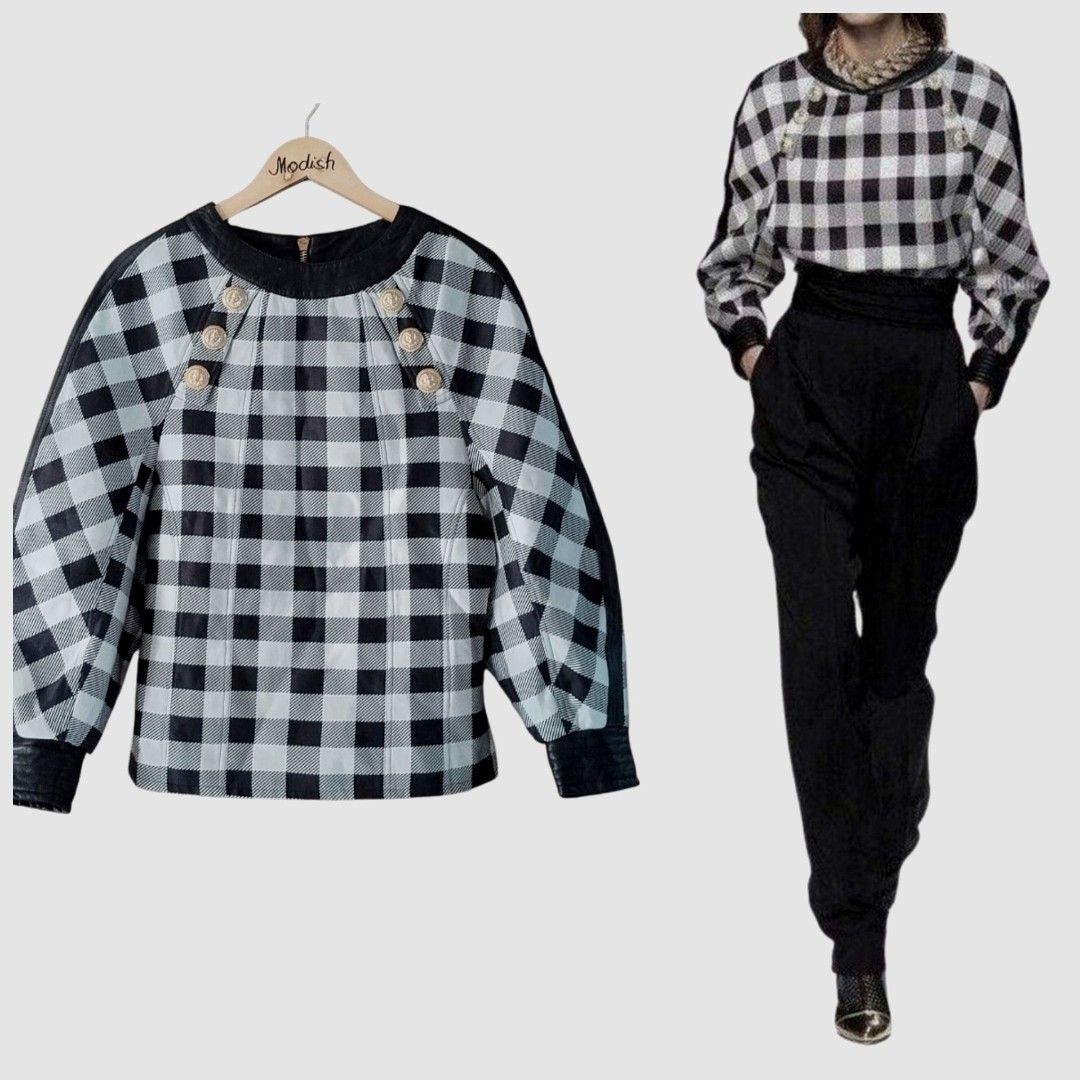 Balmain Voluminous Sleeve Top (Category: Luxury Apparel) located in Caloocan City. Submitted by modishthriftstore (Listing ID 1470369857, Image 1). Description: @BALMAIN rare runway piece from Olivier Rousteing's collection. *gingham check design w/ heavy gold lion-embossed statement shoulder buttons, and LAMB Leather accents at the collar and cuffs. *UNIQUE & STYLISH *Voluminous Sleeves/THICK material Orig SRP: 90,000+ ❤SMALL B:34 L:24 Loc : Nor