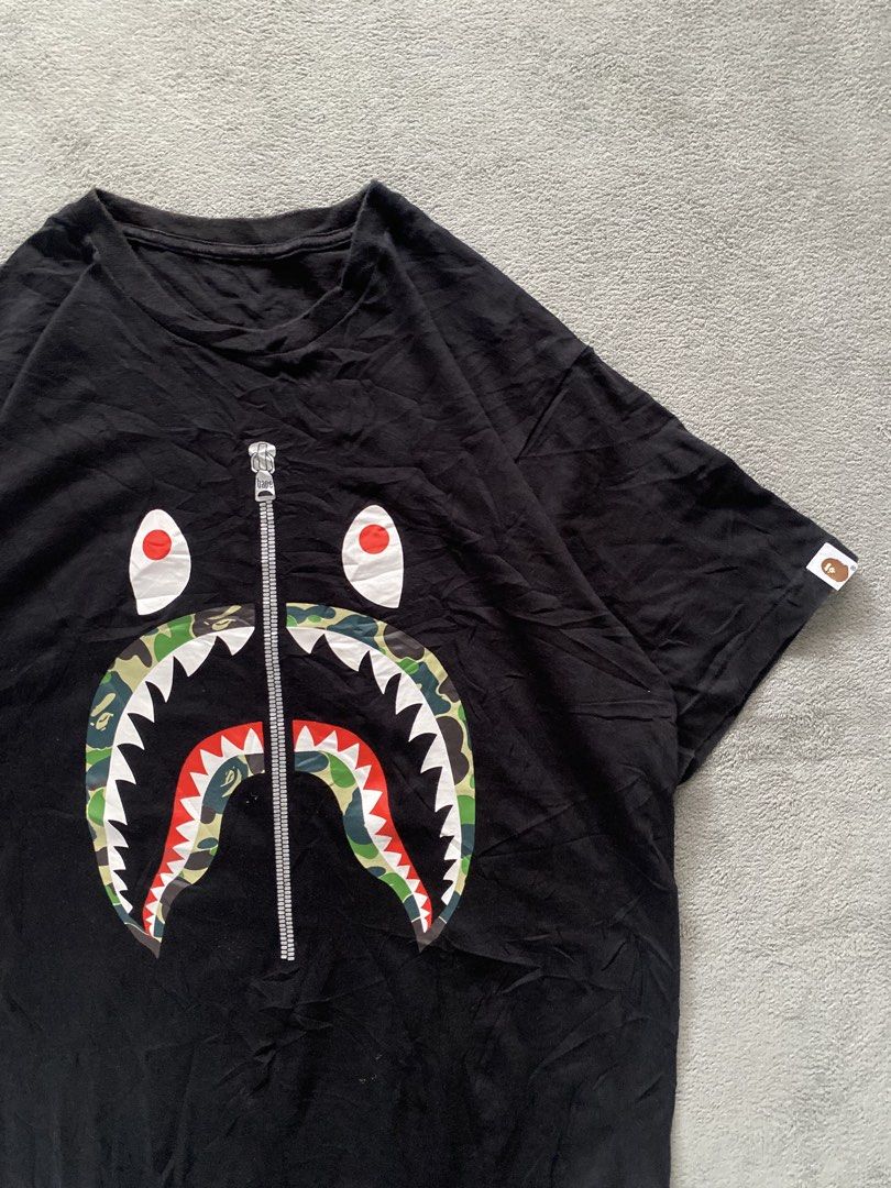 Bape Shark Shirt (off) (Category: Tshirts & Polo Shirts ) located in Ozamiz City. Submitted by thriftnikael (Listing ID 1470510824, Image 2). Description: width: 22 length: 28.5 size: large Color rate: 10/10 Condition: 10/10 Issue: n/a .