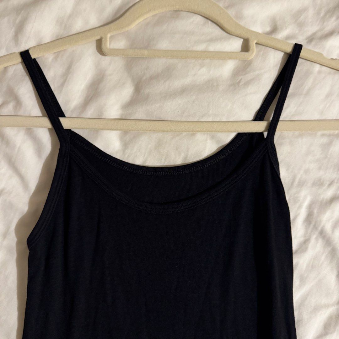 Basic Black Camisole Tank Top (Category: Sleeveless) located in Quezon City. Submitted by ianne.declutter (Listing ID 1470370504, Image 2). Description: - Color: Classic black - Design: Scoop neckline with thin spaghetti straps - Material: Soft and stretchy fabric for a comfortable fit - Styling: Perfect for layering or pairing with jeans and skirts - Condition: Brand new / Excellent basic wardrobe staple.