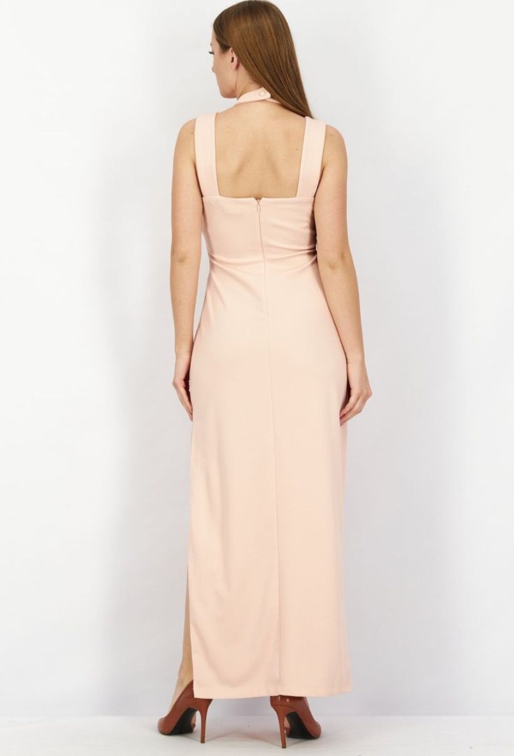 Bebe Maxi Dress Peach Halter Neck (Category: Dresses) located in Baliuag. Submitted by crateandbarrel (Listing ID 1470538315, Image 3). Description: - Brand: Bebe - Style: Halter maxi dress with cutout and side slit - Color: Soft peach - Size: Fits S to M - Closure: Back zipper - Occasion: Perfect for evening events, dinners, and parties - Mode of Payment: GCash, BPI, or COD via Shpee/Lzada checkout - Shipping: Ships locally via J&T Express (Metr