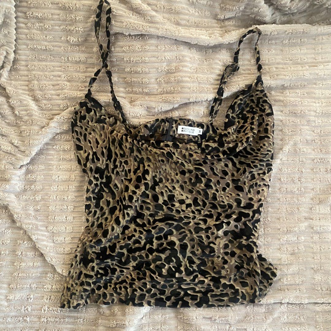 Beginning Boutique Leopard Print Cami Top Size M (Category: Sleeveless) located in San Jacinto. Submitted by deeymsells (Listing ID 1470377145, Image 1). Description: - Brand: Beginning Boutique - Style: Leopard print velvet camisole - Size: Medium - Features: Adjustable spaghetti straps, cowl neckline, back zipper detail - Material: Soft velvet with slight stretch - Condition: Great for going out or layering under a jacket.