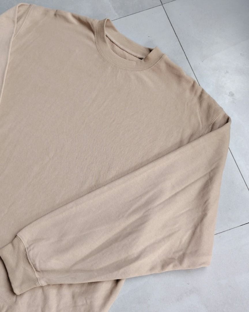 Beige Long Sleeve Crewneck Sweatshirt (Category: Longsleeves) located in Bauang. Submitted by wornskript (Listing ID 1470480772, Image 2). Description: Boxy Drop-Shoulder Long Sleeve Shirt Size : Large Dimes : 25" x 27.5" - Color: Plain beige - Material: Thick, high-quality cotton - Fit: Relaxed with a trendy drop-shoulder design - Details: Ribbed crewneck, cuffs, and hem - Style: Minimalist, basic, and versatile for layering or casual daily wear