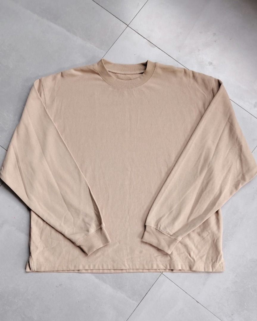 Beige Long Sleeve Crewneck Sweatshirt (Category: Longsleeves) located in Bauang. Submitted by wornskript (Listing ID 1470480772, Image 1). Description: Boxy Drop-Shoulder Long Sleeve Shirt Size : Large Dimes : 25" x 27.5" - Color: Plain beige - Material: Thick, high-quality cotton - Fit: Relaxed with a trendy drop-shoulder design - Details: Ribbed crewneck, cuffs, and hem - Style: Minimalist, basic, and versatile for layering or casual daily wear