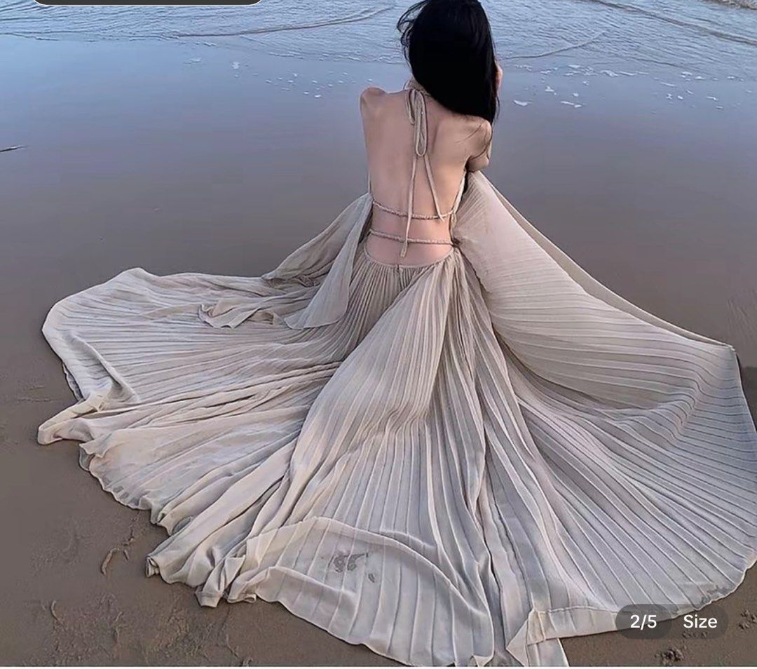 Beige pleated halter neck open back maxi dress (Category: Dresses) located in Makati City. Submitted by lemoneyeddd (Listing ID 1470501609, Image 2). Description: - Color: Elegant beige - Material: Flowy chiffon that moves beautifully in the wind - Style: Halter neck, open back with tie straps, floor-length with a gorgeous flare - Design: All-over pleats - Condition: Worn once for a beach trip, freshly washed, and ready to wear - Mode of Payment: