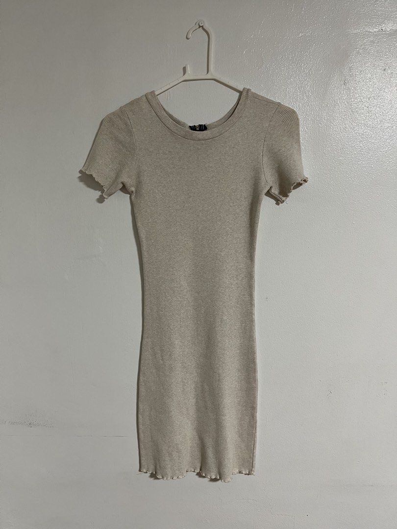 Beige ribbed knit mini dress with half zip (Category: Dresses) located in Cabuyao City. Submitted by rdtrmt (Listing ID 1470476955, Image 1). Description: - Style: Bodycon fit mini dress - Color: Beige - Details: Ribbed knit fabric, short sleeves with lettuce hem, back half-zip closure - Fit: Super stretchy - Condition: Clean and still in good condition .
