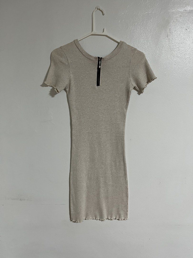 Beige ribbed knit mini dress with half zip (Category: Dresses) located in Cabuyao City. Submitted by rdtrmt (Listing ID 1470476955, Image 3). Description: - Style: Bodycon fit mini dress - Color: Beige - Details: Ribbed knit fabric, short sleeves with lettuce hem, back half-zip closure - Fit: Super stretchy - Condition: Clean and still in good condition .