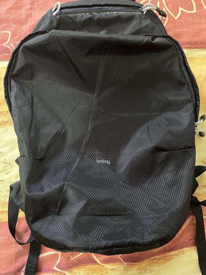 Bellroy Lite Backpack Black (Category: Backpacks) located in Tayabas. Submitted by ste1n (Listing ID 1470402326, Image 1). Description: - Bellroy Lite Backpack - Color: Classic Black with white zipper pulls and branding - Material: Durable, lightweight ripstop with grid pattern - Comfort: Padded mesh shoulder straps and back panel for all-day wear - Clean interior with multiple slots and a brand slip pocket - Condition: Great everyday carry bag, 