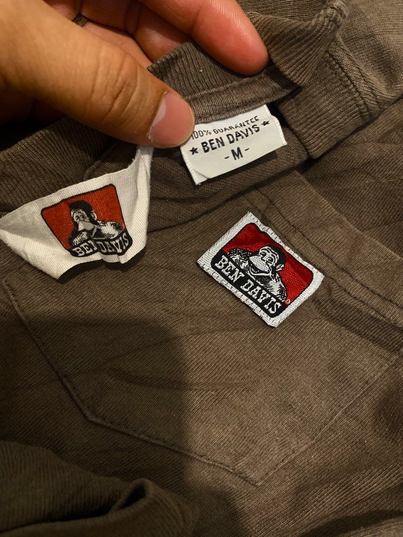 Ben Davis Pocket T-Shirt Brown Size M (Category: Tshirts & Polo Shirts ) located in Cebu City. Submitted by tangubrhia45277 (Listing ID 1470474591, Image 3). Description: - Brand: Ben Davis - Item: Pocket T-Shirt - Color: Brown - Size: Medium (M) - Material: 100% cotton - Features: Classic logo patch on chest pocket, ribbed crew neckline, short sleeves - Condition: Clean tag and branding label intact - Style: Simple everyday streetwear.