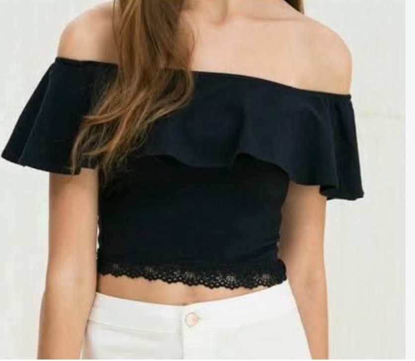 Bershka Black Off-Shoulder Crop Top (Category: Sleeveless) located in Paranaque City. Submitted by calm_youngstore7 (Listing ID 1470392520, Image 1). Description: BNWT - Brand: Bershka - Color: Classic Black - Design: Off-shoulder with chic ruffle overlay - Fit: Fitted bodice featuring delicate lace trim on the bottom hem - Styling: Perfect for casual days or evening hangouts; looks amazing with high-waisted jeans or skirts - Condition: Excellent