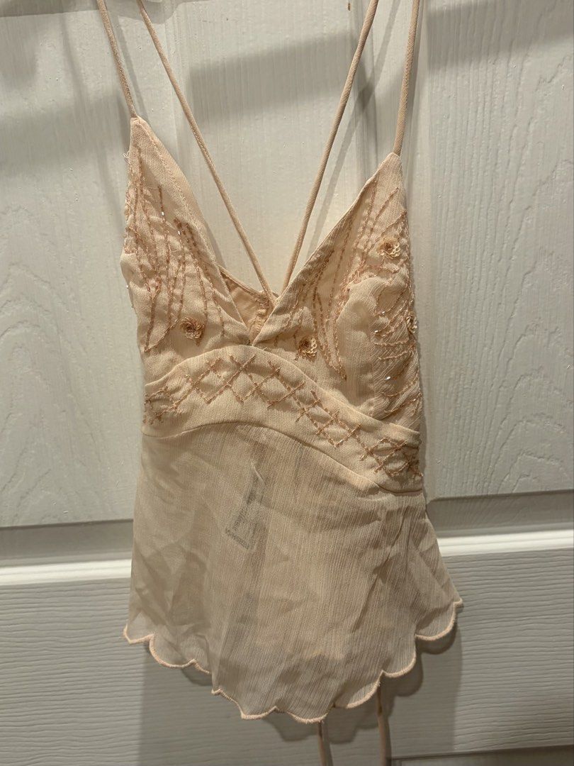 BERSHKA Pink Tie Back Sequin Top (Category: Sleeveless) located in Pasig City. Submitted by mmsells15 (Listing ID 1470500404, Image 3). Description: - used once and washed - original price is 1k+ - tie at the back - rfs: decluttering 📍Kapitolyo, Pasig City MOP: GCASH/BPI MOD: Lalamove/Grab/J&T.