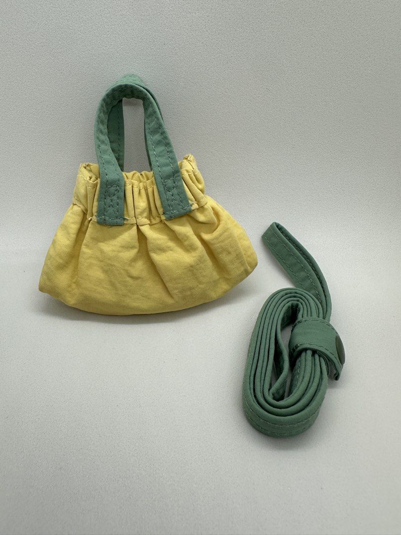Beyond the Vines Teeny Tiny Micro Dumpling - Yellow Colorblock (Category: Cross-body Bags) located in Quezon City. Submitted by afpar (Listing ID 1470497454, Image 2). Description: - Brand: Beyond The Vines - Style: Micro Dumpling Bag - Colorway: Yellow body with green handles and pink front pocket - Included: Detachable matching green crossbody strap - Features: Ruffled top edge and embroidered brand text on the front pocket - Condition: Brand n