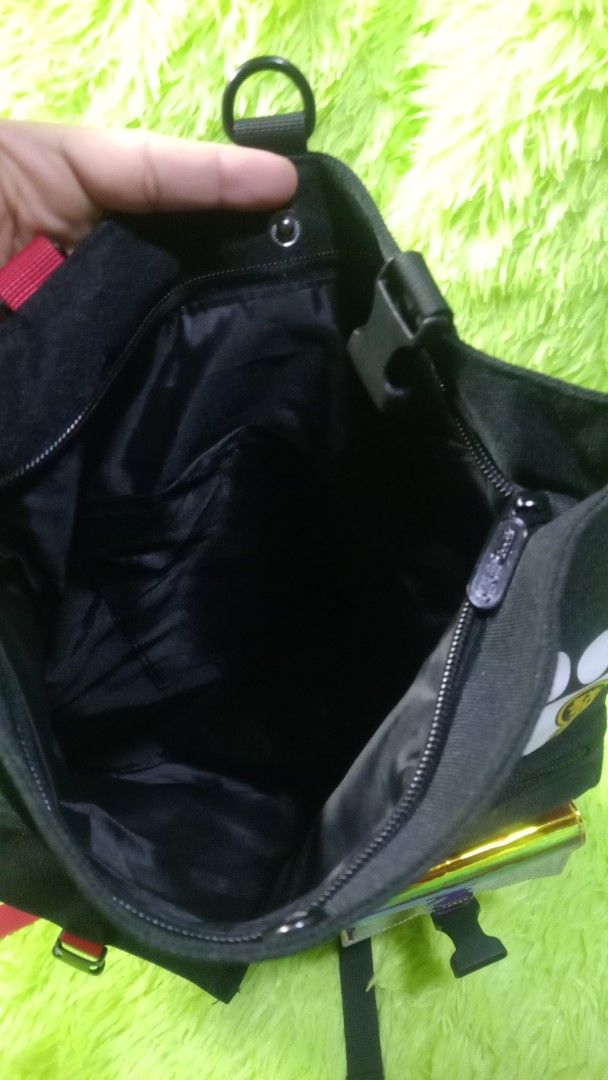 Bilibili Goods Black Messenger Bag (Category: Sling Bags) located in Manila. Submitted by twinklelyn03 (Listing ID 1470416907, Image 3). Description: - Brand: Bilibili Goods - Color: Classic black with red brand tag - Material: Sturdy, durable canvas - Features: Adjustable shoulder strap, secure front flap with buckle closures, main zip compartment, interior slip pockets, and exterior D-rings for attachments see photos for details pm sa sure buye