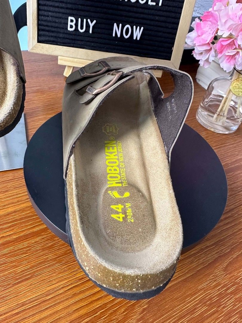 Birkenstock (Category: Slippers & Slides) located in Baguio. Submitted by kayeonlineshop (Listing ID 1470395180, Image 3). Description: • Model: Birkenstock Arizona • Color / Material: Faded Khaki / Olive natural oiled leather upper with a cork footbed. • Size: EU 44 (Visible on the footbed)..