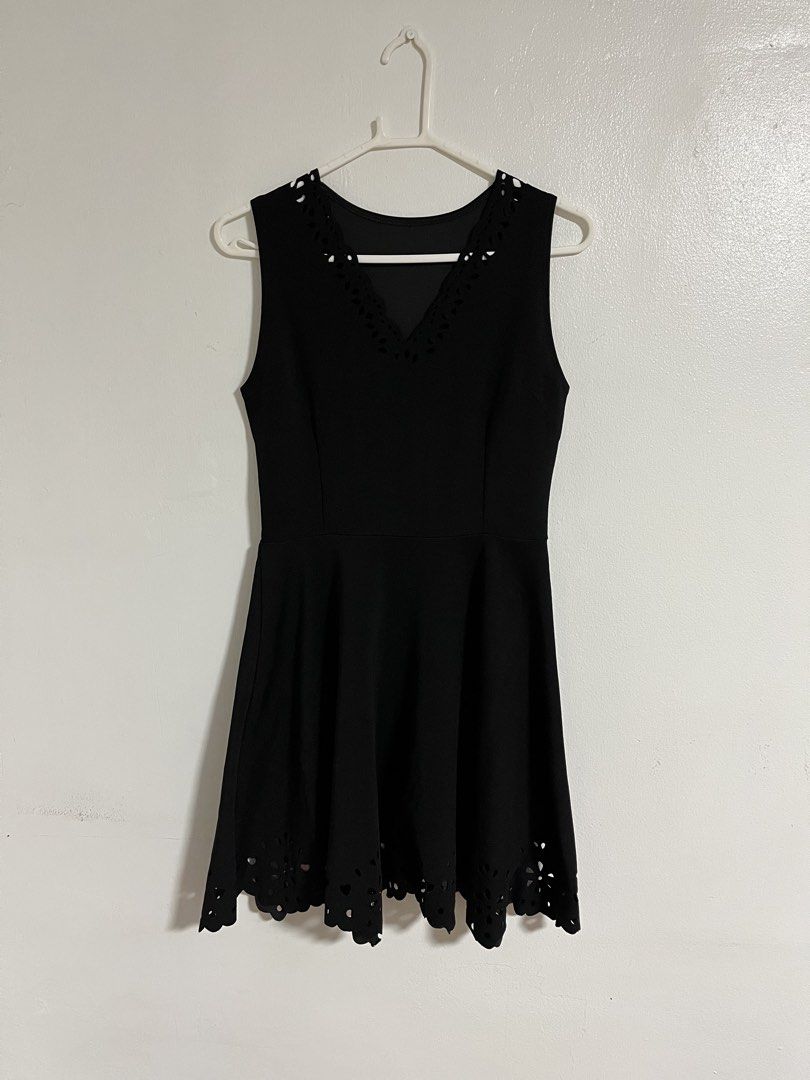 Black A-line Sleeveless Dress (Category: Dresses) located in Cabuyao City. Submitted by rdtrmt (Listing ID 1470440274, Image 1). Description: - Color: Black - Design: Sleeveless with a fitted bodice, waist seam, and flared skirt - Details: Elegant laser-cut scalloped pattern along the V-neckline and bottom hem - Back: Simple scoop back design - Versatility: Perfect for casual outings or dinners - Condition: still in good condition.