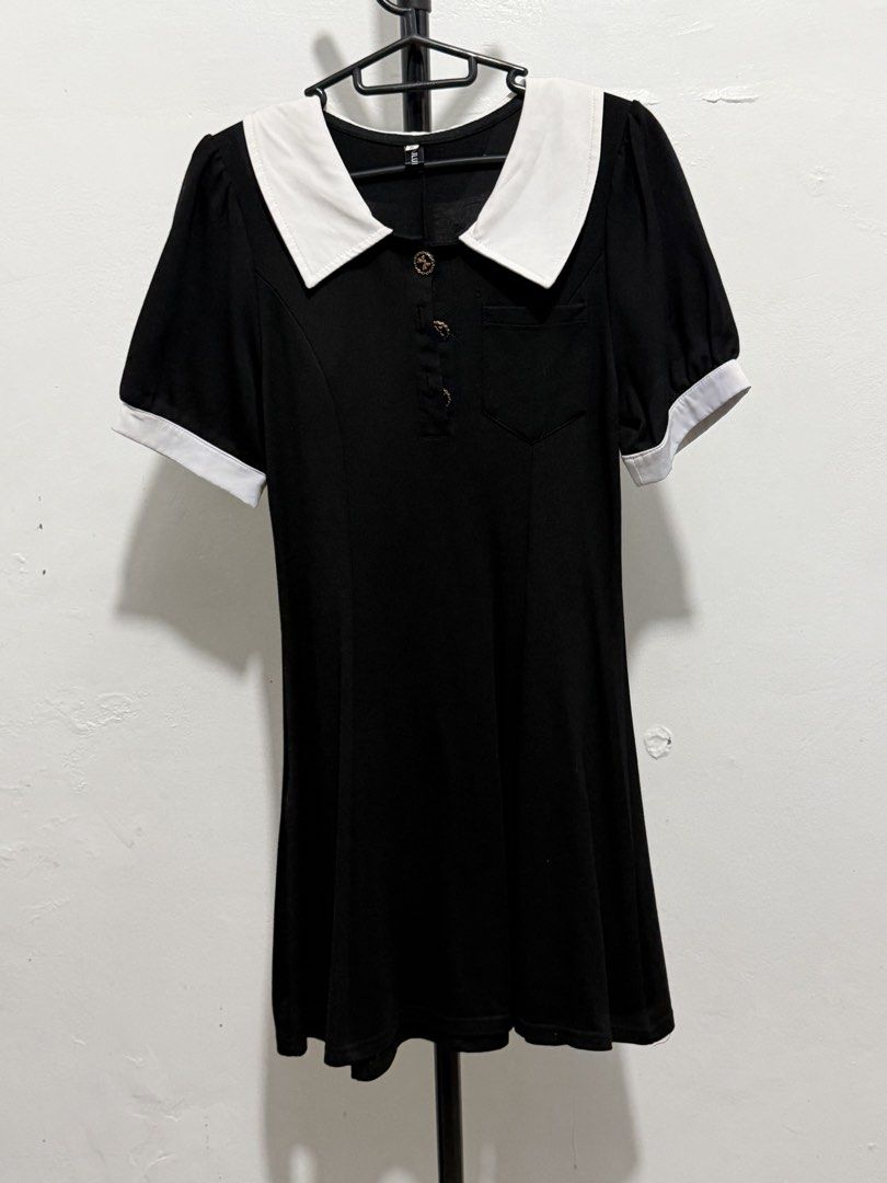 Black and White Collar Dress (Category: Dresses) located in Mandaluyong City. Submitted by jdflores17 (Listing ID 1470455965, Image 1). Description: - Color: Classic black with contrasting white collar and sleeve cuffs - Design: Three decorative front buttons, small left chest pocket, and a flattering flared skirt hem - Fabric: Lightweight, comfortable, and easy to wear all day - Versatility: Perfect for casual daily wear, work, dates, or semi-fo