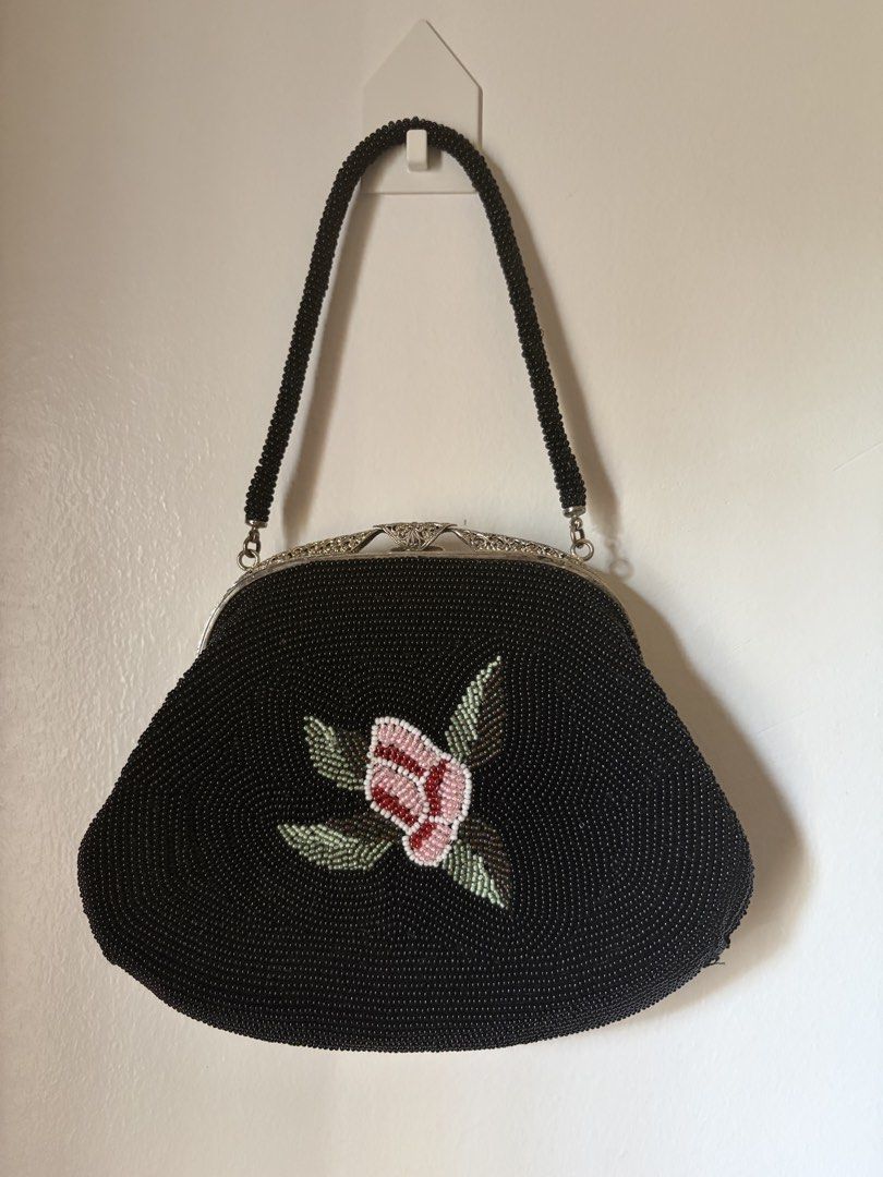 Black beaded handbag with rose motif (Category: Purses & Pouches) located in Las Pinas. Submitted by bibliomomma (Listing ID 1470403307, Image 2). Description: Gorgeous vintage-style black beaded handbag featuring an intricate pink rose and green leaf floral design. It comes with a matching beaded handle, an ornate clasp closure, and an elegant structured silhouette. Perfect for special occasions, dinners, or adding a chic touch to any outfit MOP
