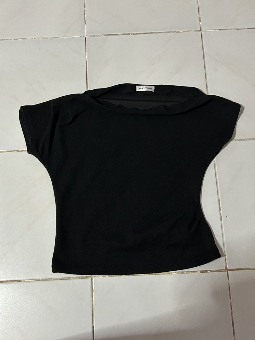 Black Boat Neck Asymmetrical Top (Category: Blouses) located in Manila. Submitted by viyyu (Listing ID 1470414568, Image 1). Description: •Boat neckline, asymmetrical one shoulder •Fitted cut through the waist •Clean fabric with neat stitching along hems •Origin: Made in Vietnam.