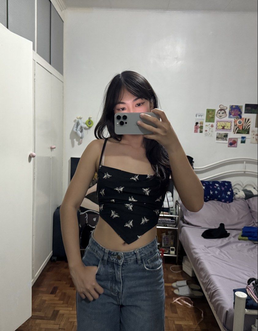 Black Butterfly Print Halter Crop Top Size S (Category: Sleeveless) located in Angeles City. Submitted by m1lkramen (Listing ID 1470468302, Image 1). Description: - Style: Cropped halter top with open back and adjustable lace-up straps - Design: All-over white butterfly graphics on black fabric - Size: S (EUR/US S, CN 160/88A) - Material: Soft and stretchy - Condition: Worn once for a quick photo, practically untouched - Best for: Summer days or 
